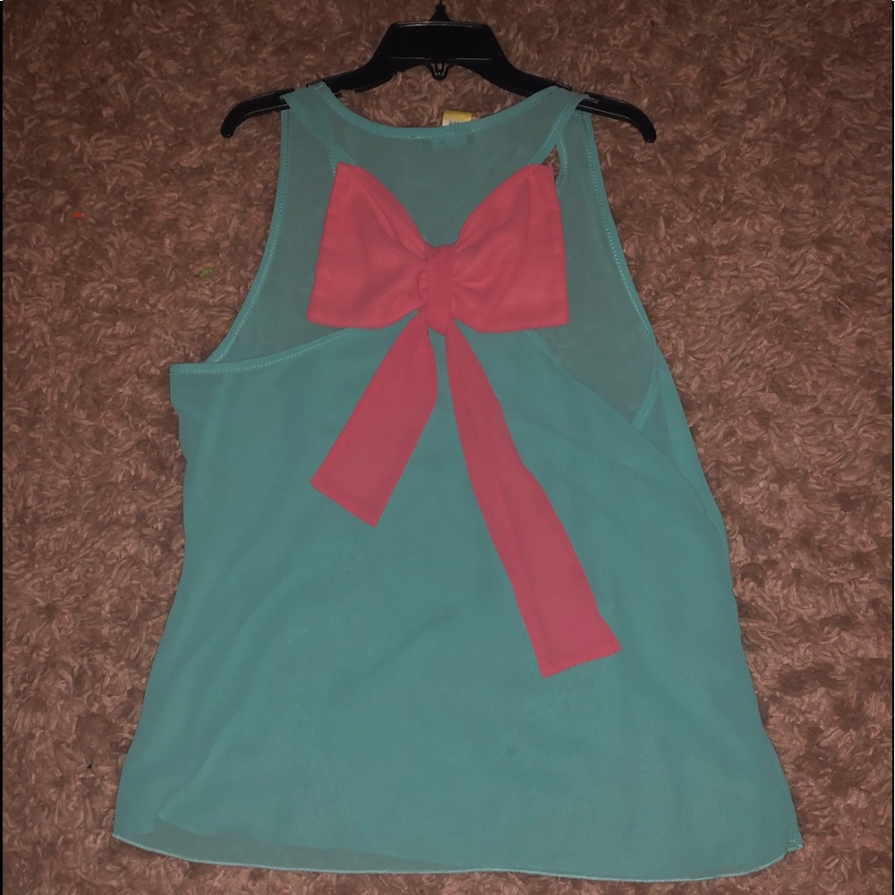 Mi a Mi blouse with pink ribbon on back in medium.